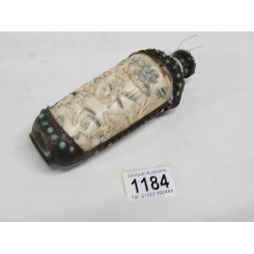 1184 - An antique carved ivory and bronze Chinese scent bottle carved with battle scenes, 16.5cm