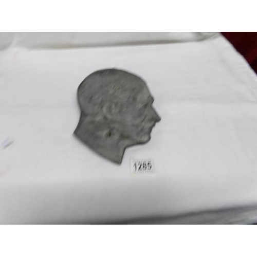 1285 - A metal wall mask of Adolph Hitler