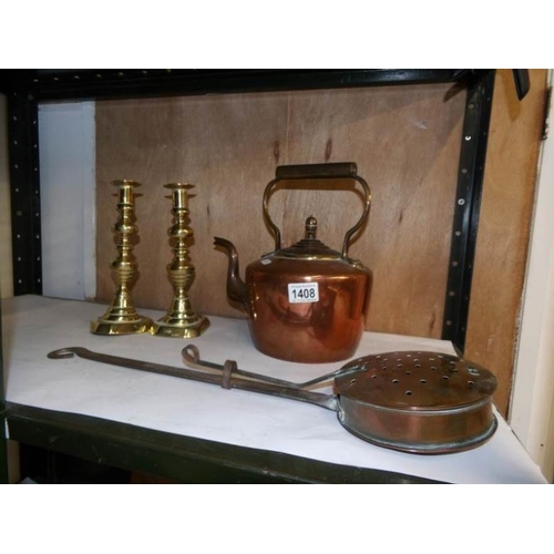 1408 - A Victorian copper kettle, a copper chestnut roaster and a pair of Victorian brass candlesticks