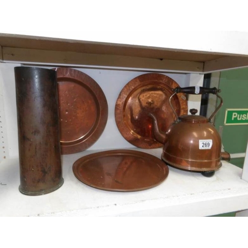 269 - A copper bed pan, copper kettle, 3 plaques and a brass gun shell