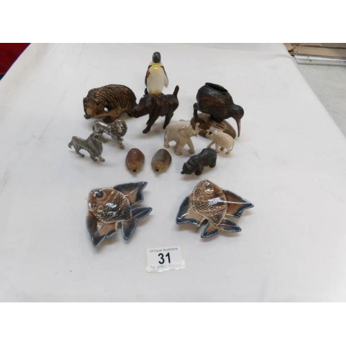 31 - A collection of animal figures including Wood, metal, china and Wade