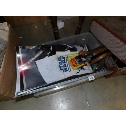 402 - A box of Star Wars memorabilia including posters, figures etc