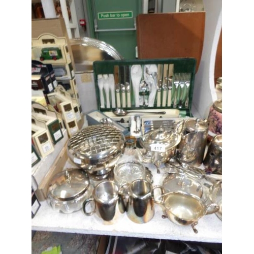 417 - A mixed lot of silver plate including biscuit barrel, cutlery, coffee pot etc