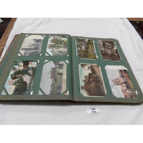 48 - An Edwardian postcard album containing approximately 200 post cards