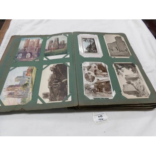 48 - An Edwardian postcard album containing approximately 200 post cards