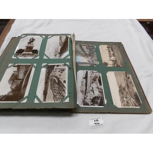 48 - An Edwardian postcard album containing approximately 200 post cards