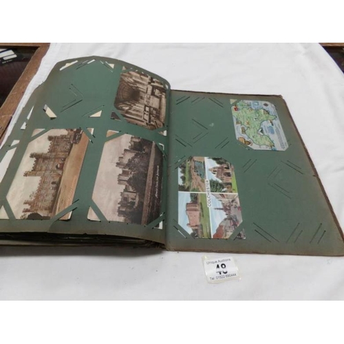 48 - An Edwardian postcard album containing approximately 200 post cards