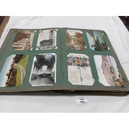 48 - An Edwardian postcard album containing approximately 200 post cards