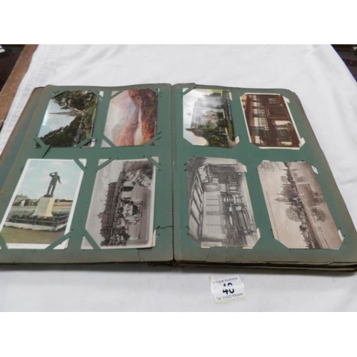 48 - An Edwardian postcard album containing approximately 200 post cards