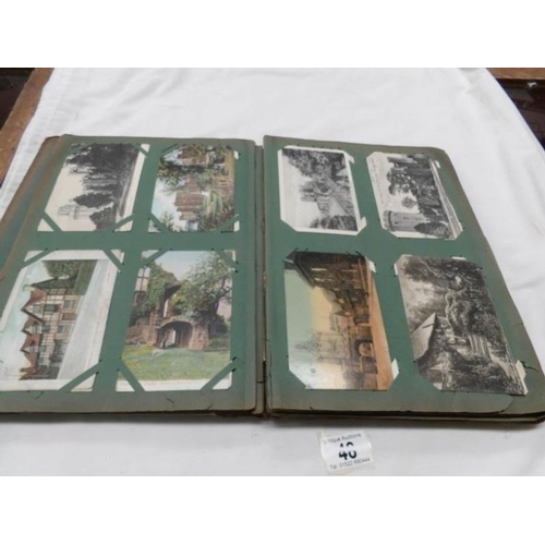 48 - An Edwardian postcard album containing approximately 200 post cards