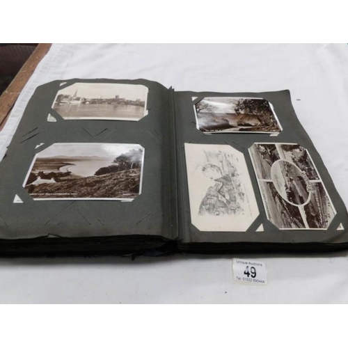 49 - An Edwardian postcard album containing approximately 260 postcards