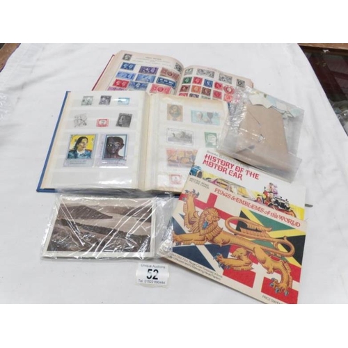 52 - 2 world stamp albums, post cards, loose stamps etc