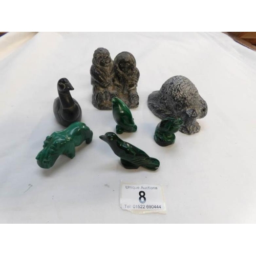 8 - A mixed lot of carved figures and animals including Inuit