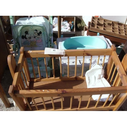 45 - 3 children's toys including swinging crib