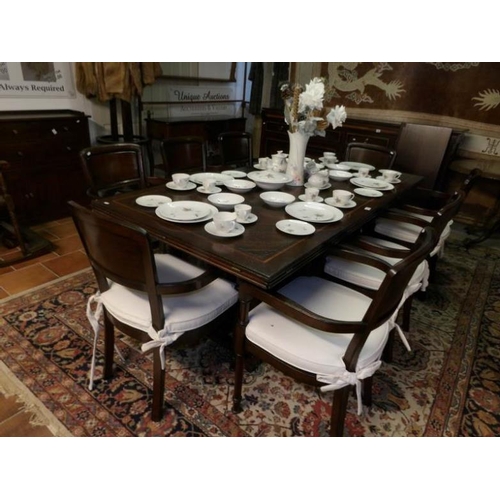 1731 - A mahogany inlaid table with multiple drop leaves and a set of 8 carver chairs