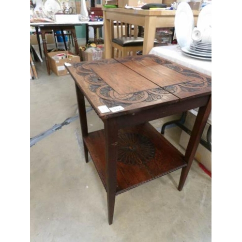 432 - A 1920's carved oak side table