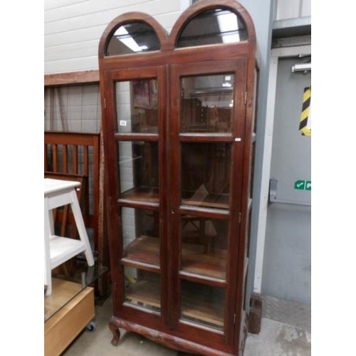 478 - An oak arched top book case