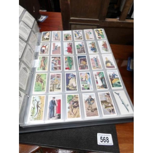 568 - A large album of mainly cigarette cards including silks and some reprints