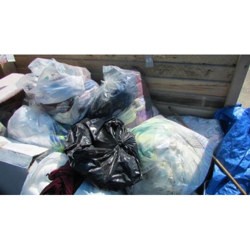 75 - A large quantity of bags of clothes and curtains