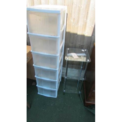 87 - A glass table and a 6 drawer plastic chest