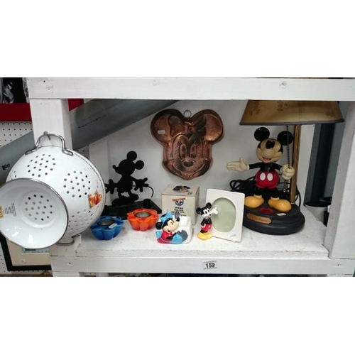 159 - A Mickey mouse lamp etc and other assorted memorabila inc. Disney - 3 shelves