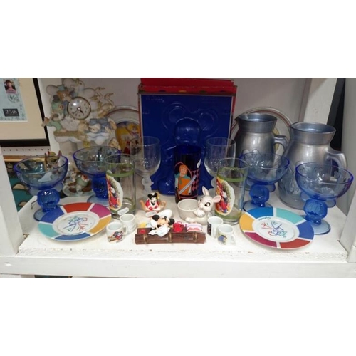 159 - A Mickey mouse lamp etc and other assorted memorabila inc. Disney - 3 shelves