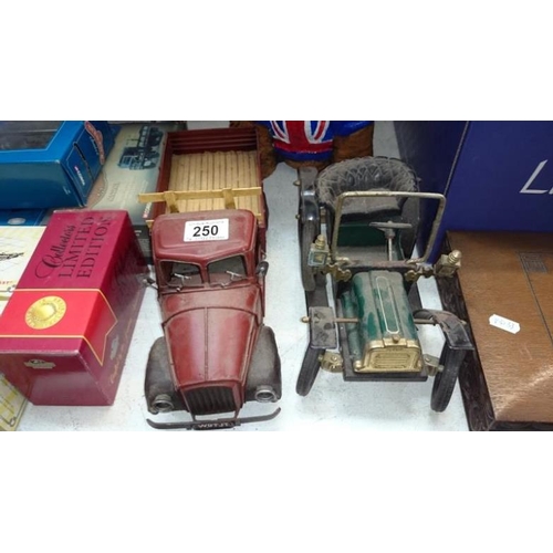 250 - A vintage style tinplate vintage car and American lorry