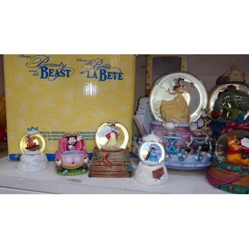 87 - A collection of Disney snow globes