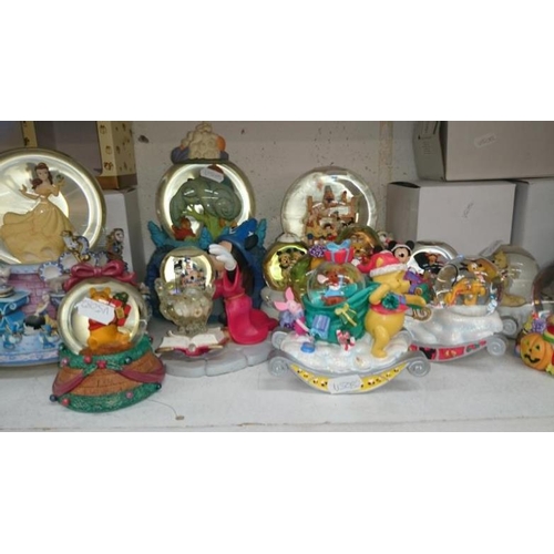 87 - A collection of Disney snow globes