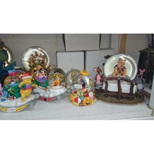 87 - A collection of Disney snow globes