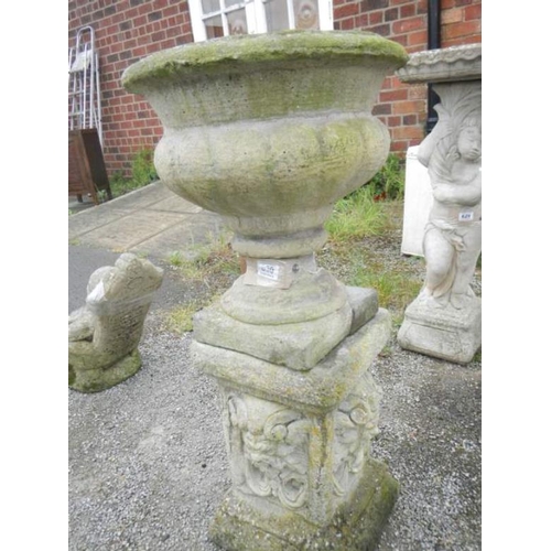 630 - A concrete urn on stand