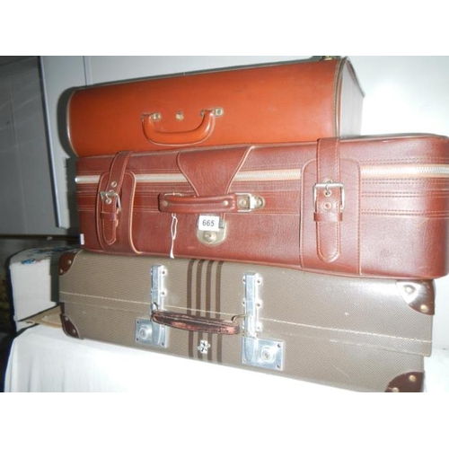 665 - 3 old suitcases