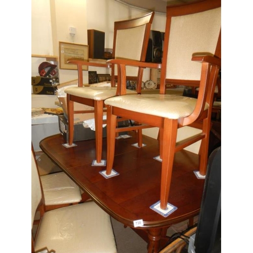 738 - A mahogany table and 4 chairs