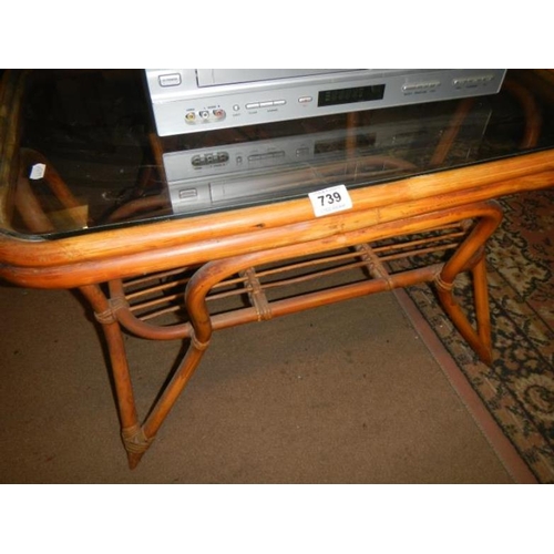 739 - A bamboo table with glass top