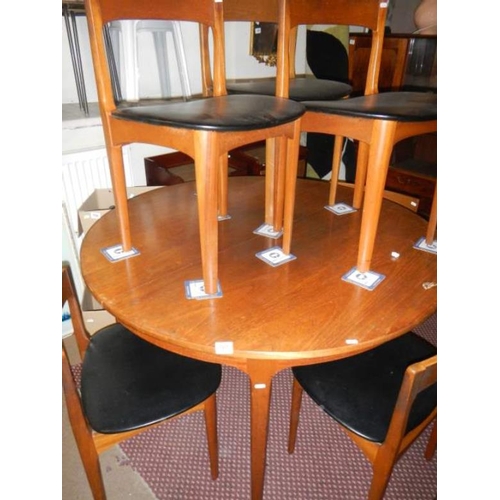 767 - A teak table and 6 chairs