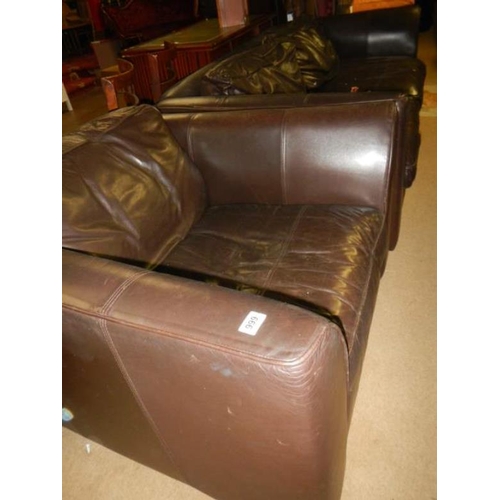 999 - A leather settee and armchair