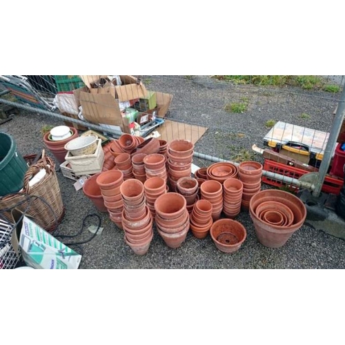 397 - A large quantity of terracotta plant pots