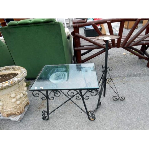 318 - A metal framed, glass topped table etc