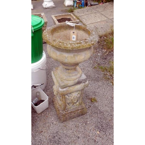 323 - A stone garden planter on plinth