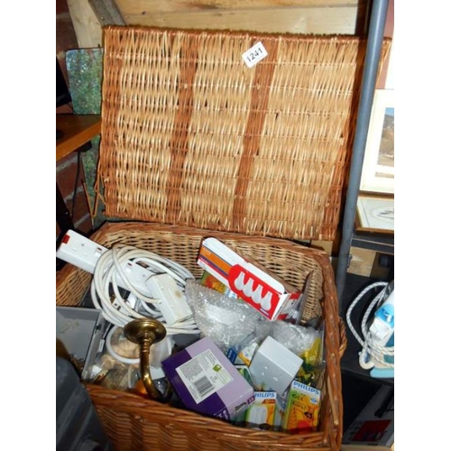 1241 - A wicker basket with light bulbs etc.