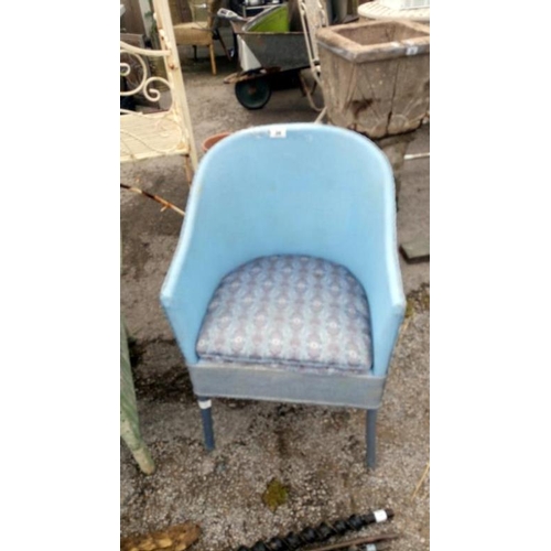 34 - A blue wicker bedroom chair