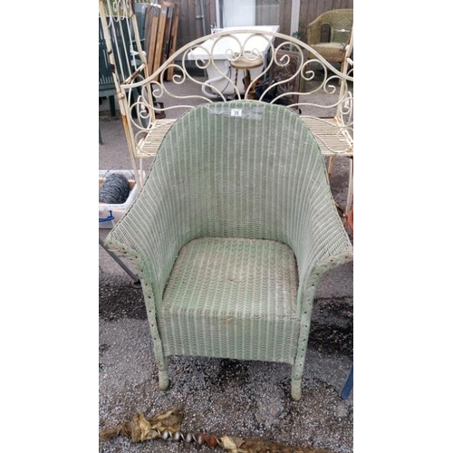 35 - A green wicker bedroom chair