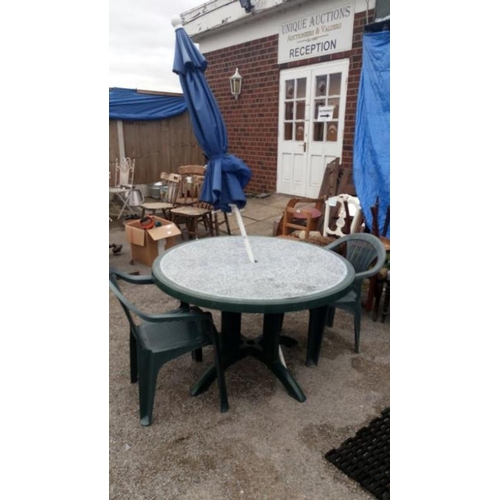 39 - A garden table, 2 chairs & a parasol