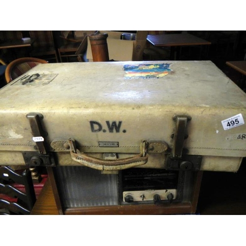 495 - An old pig skin suitcase