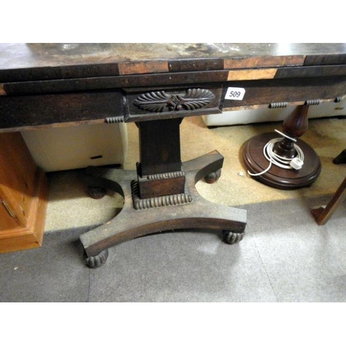 509 - A Victorian fold over rosewood card table