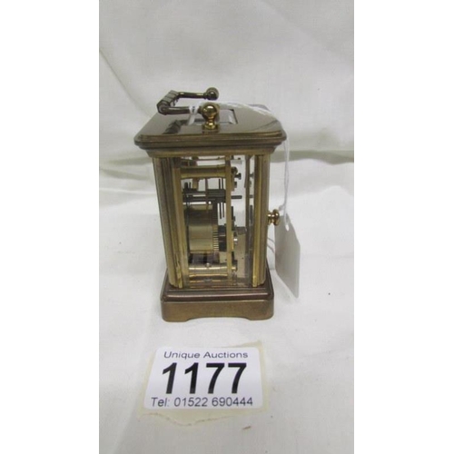 1177 - A miniature brass carriage clock marked Matthew Norman, London