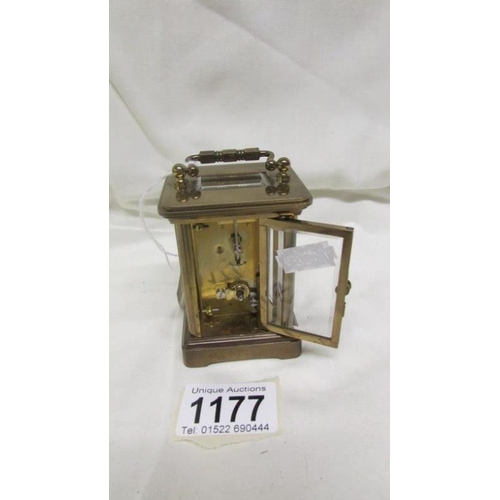 1177 - A miniature brass carriage clock marked Matthew Norman, London