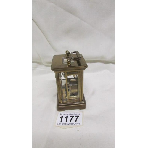 1177 - A miniature brass carriage clock marked Matthew Norman, London