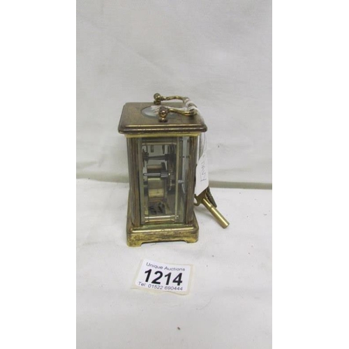 1214 - A brass carriage clock by Dyson & Son, Leeds