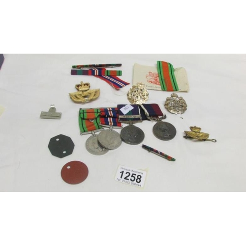 1258 - A Malaya medal and a Long service medal both awarded to Sgt. W E Warren RAF together with 2 WW2 meda... 